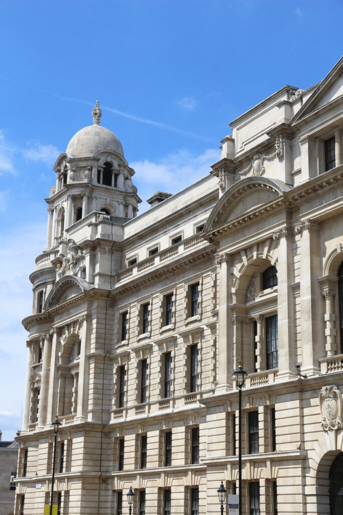 A large UK government building featuring numerous windows, showcasing its impressive architectural design.