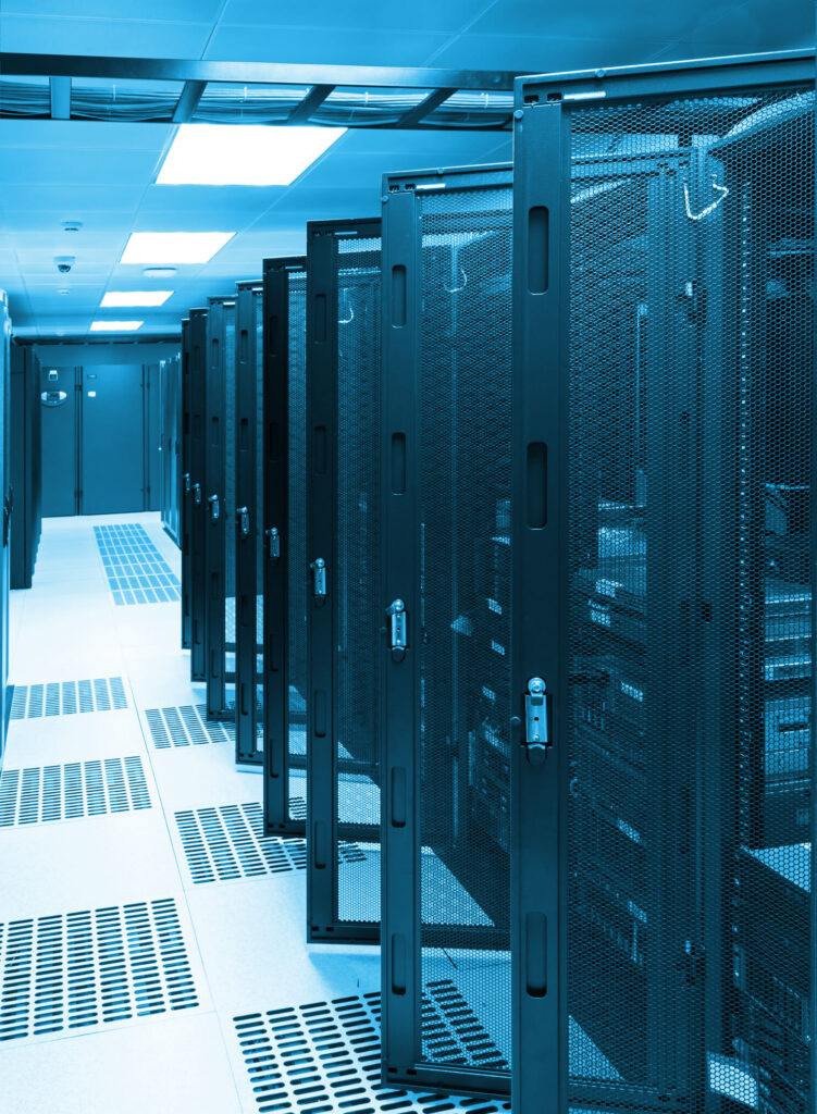 A row of secure server racks in a data center with metal mesh doors, illuminated by cool blue overhead lighting. The floor has ventilation panels, and the scene is symmetrical and orderly, creating a high-tech environment.