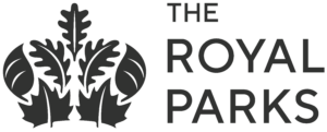 Logo of The Royal Parks features a stylized black crown with leaf motifs on the left, and the words THE ROYAL PARKS in uppercase black letters on the right. The design is simple and elegant.