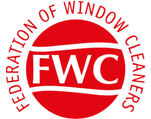 Red and white logo with the letters FWC in bold at the center. Surrounding the letters, the text reads Federation of Window Cleaners in a circular layout.