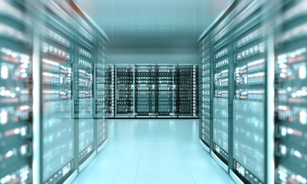 A modern, brightly lit server room with rows of server racks on both sides and a reflective white floor, creating a sleek, high-tech atmosphere.
