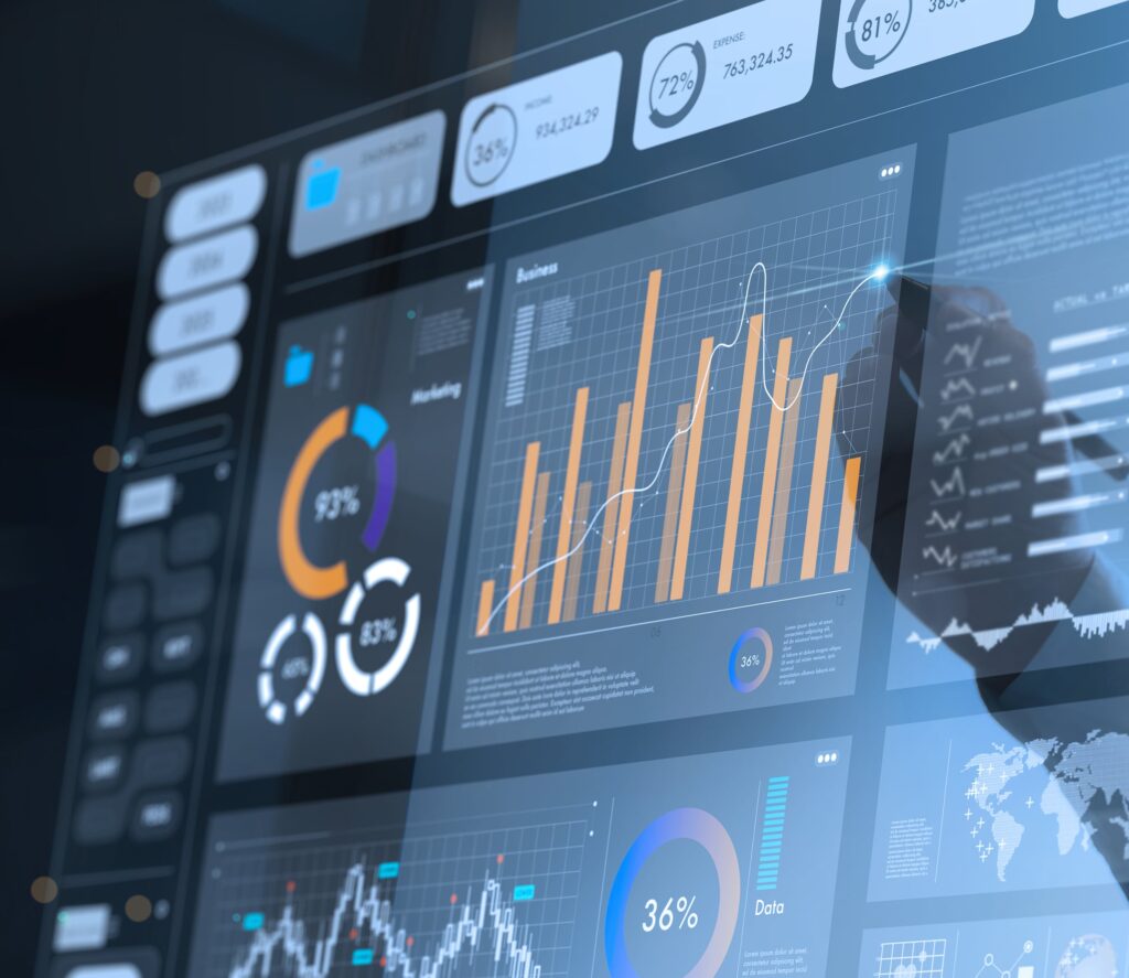 A close-up of a digital dashboard displaying colorful graphs, bar charts, pie charts, and data analytics, with a persons hand interacting on the screen, suggesting real-time data analysis.