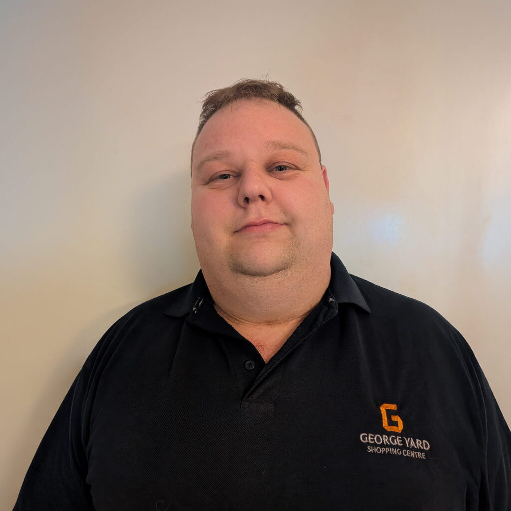 A man in a black shirt.