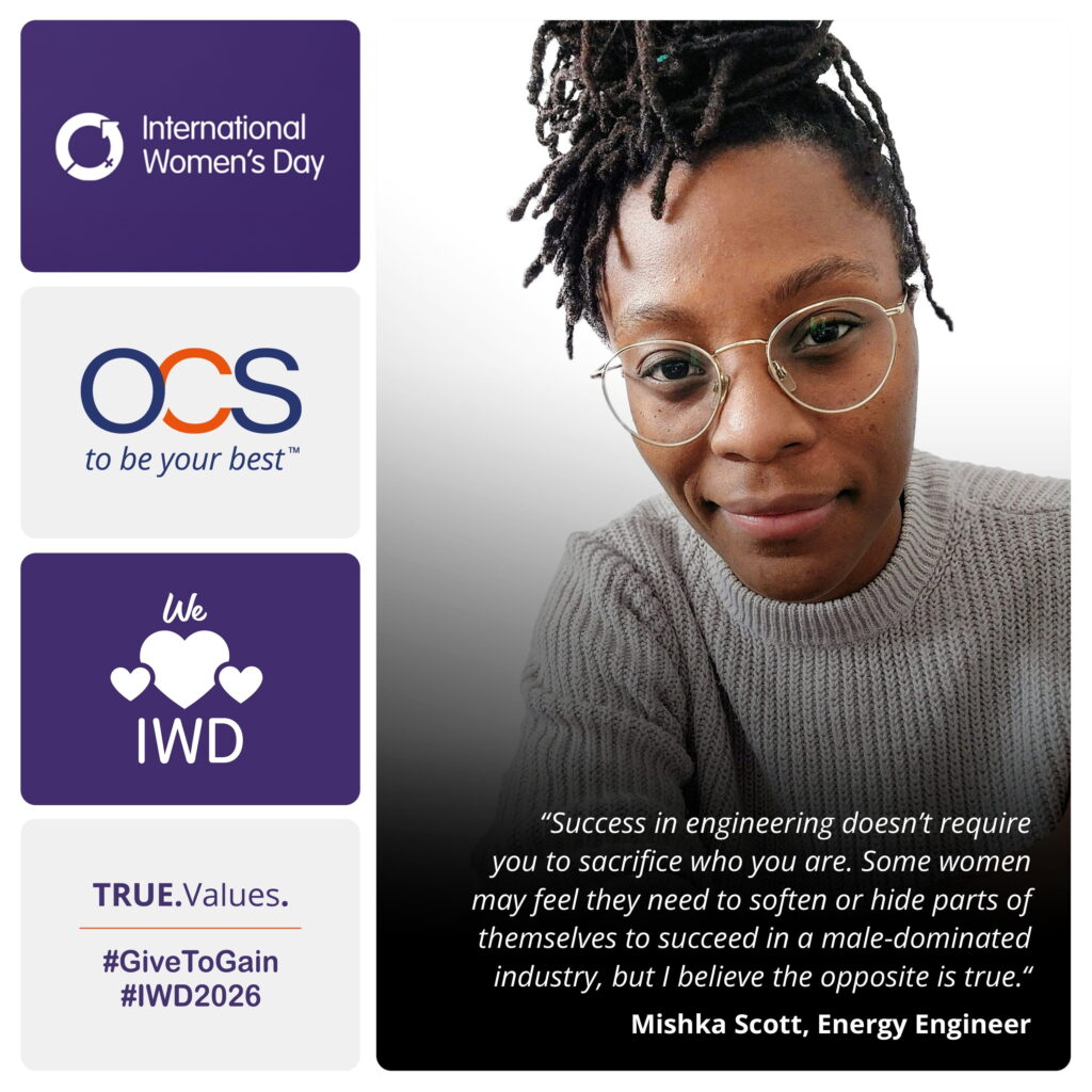 A woman with glasses and a jumper smiles at the camera. The image includes International Women’s Day graphics, OCS logo, and a quote about women’s success in engineering by Mishka Scott, Energy Engineer.