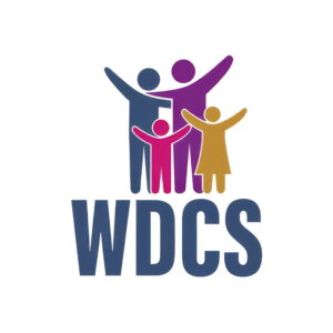 Logo with the letters WDCS below four stylised figures in blue, purple, red, and yellow, representing a group of people with their arms raised, suggesting unity and community.