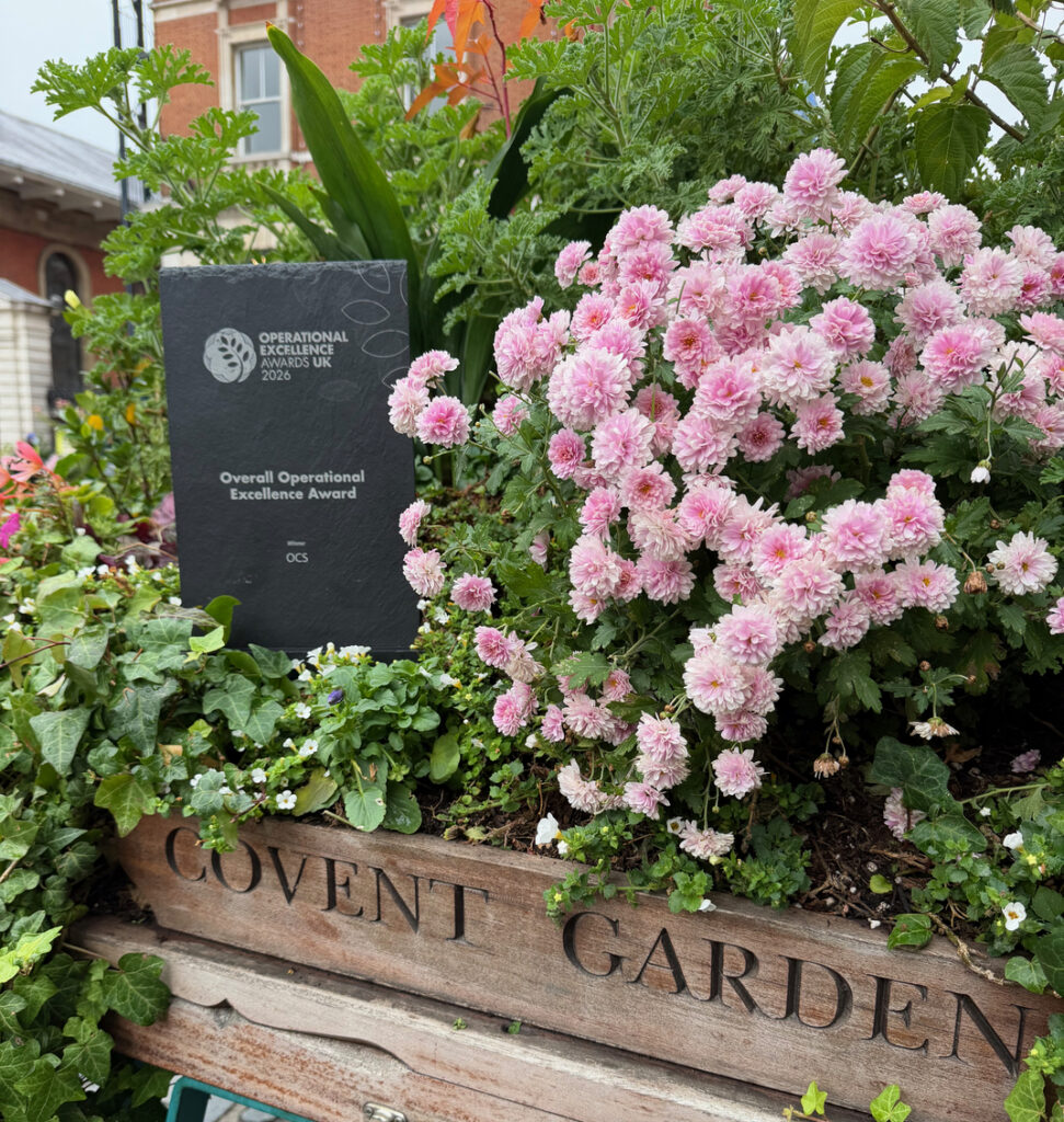 An Operational Excellence Awards 2026 trophy sits in a flower-filled planter marked Covent Garden.